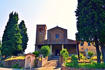 external facade of the parish church of Santa Maria and San Leonardo in the 11th century Romanesque style located in Artimino in the municipality of Carmignano in the city of Prato in Tuscany, Italy
