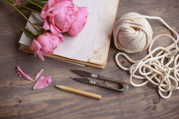 Floral frame with pink peonies on wooden background. Mothers day.