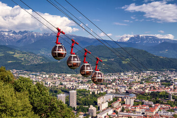 Picturesque aerial view on cable way and city. Grenoble, France. Grenoble-Bastille cable car on the foreground - obrazy, fototapety, plakaty