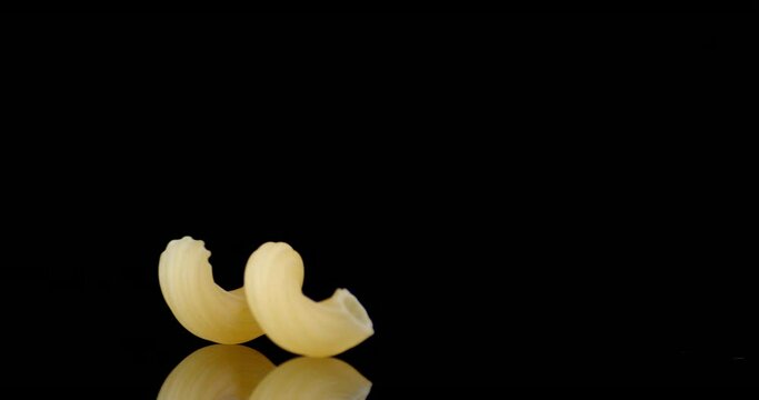 One paste of dry cavatappi bobs on the table.