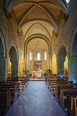 The interior of the beautiful church of Santa Maria and San Leonardo, divided into three naves covered by fourteenth-century cross vaults located at Artimino, Prato, Tuscany, Italy