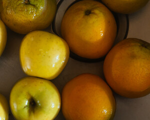 Photograph of a set of fruits that are being washed