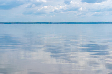 Fototapeta premium Landscape overlooking the sea, in the back with a bright blue sky