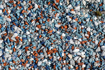 track surface made of crushed multi-colored natural stone