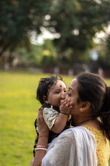 Happy loving family. Mother and her son playing, laughing, kissing and hugging.