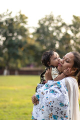 Fototapeta premium Happy loving family. Mother and her son playing, laughing, kissing and hugging.