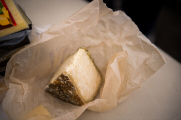 Heads of cheese. Hard cheese. Cheese. Cheese Festival. Craft cheese. A piece of hard cheese. 