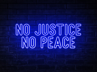 Fototapeta na wymiar No justice, no peace - blue neon light word on brick wall background