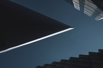 Abstract background. View through modern architecture upwards to blue sky  - abstract architecture detail background in turquoise teal blue.