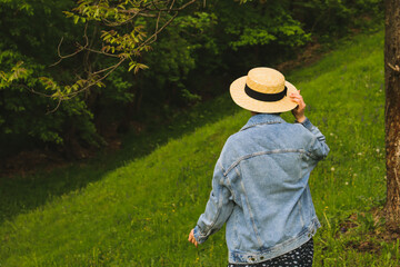 Woman in hat in the garden