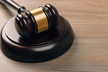 Symbol of law and justice on wooden table in lawyer office