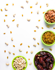 khajur, raisin/kismis, kaju badam/ cashew and almonds all at a single frame stock image white background.
