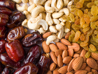 khajur, raisin/kismis, kaju badam/ cashew and almonds all at a single frame stock image white background.
