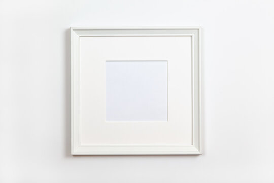 White clean square frame with passepartout on white background, copy space. Flat lay or side view, minimal style mock-up. For gift shop, social media, website design.