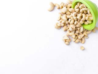 White raw cashew nuts in a white background stock image.

