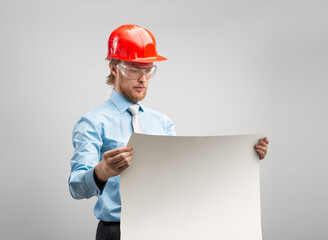 architect worker or engineer man in red construction helmet