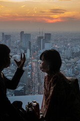 Fototapeta na wymiar mask couple at cororavirus covid sunset japan 