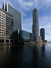 Naklejka premium A view of the modern Canary Wharf skyline in old Victorian docks on Isle of Dogs, London, United Kingdom.