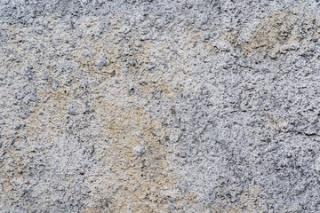 The background wall is made of cement.