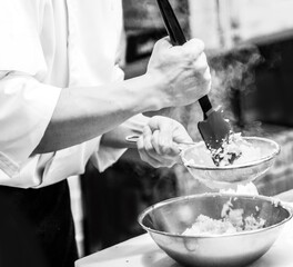 Chef cooking in a kitchen, chef at work, Black & White.