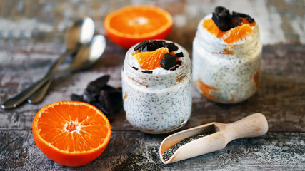 Chia yogurt with tangerines and chocolate. Healthy breakfasts or desserts. Sugar free dessert