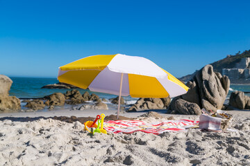 Beach Picnic with Beach Umbrella and little Spayed and Buckets.