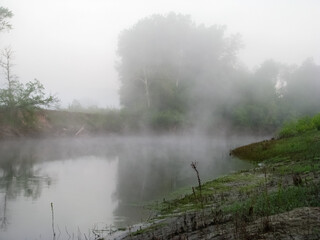 A river on a foggy morning at sunrise. Ukrainian nature