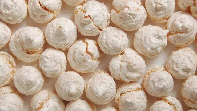 The sweet meringues light pink peach colour clockwise rotation table top still life