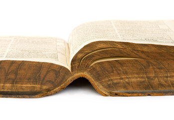 Old open book isolated on white.