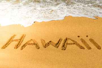 Hawaii title on the sand beach in Pacific coast.