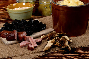 sauerkraut in a clay pot, dried plums, dried porcini mushrooms and barley porridge