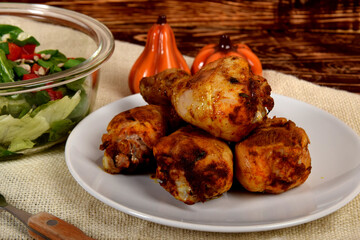 roasted chicken legs with lettuce and peppers