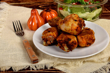 roasted chicken legs with lettuce and peppers