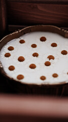 Milk and flowers in cup.