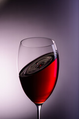 
a drop of wine flies into a wine glass7