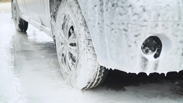 Car in foam. Car in outdoors self-service car wash