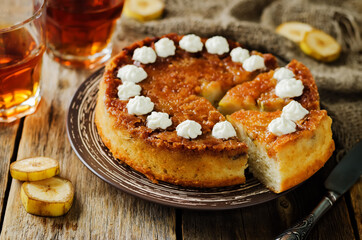 Caramel banana cake with tea in a plate