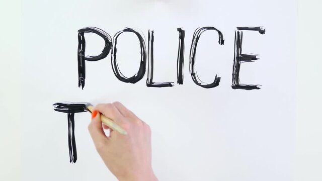 timelapse. close-up, hand writes slogan - Police Terror- with brush, using black watercolor paint on white banner, poster. Fighting against racism, for equal rights in USA.