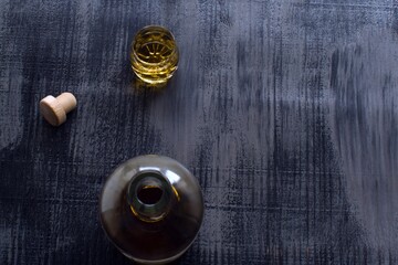 open bottle of canadian whiskey and a glass of whiskey