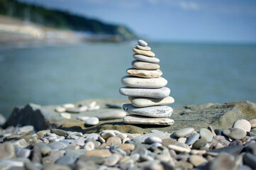 Rock stone zen tower sculpture with shallow depth view