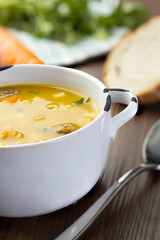 A bowl of delicious brazilian soup with beef, vegetables and noodles