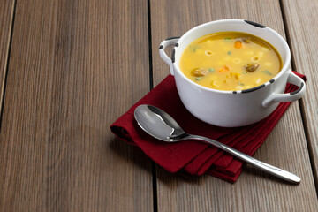 A bowl of delicious brazilian soup with beef, vegetables and noodles