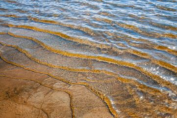 Waves on the surface of the water.