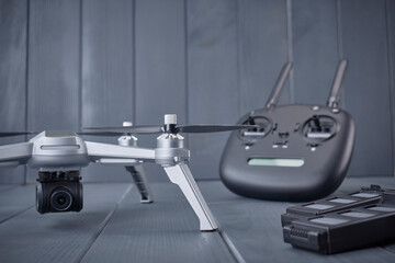 Quad-engine drone with high-resolution camera, batteries and radio control with dual frequency for capturing aerial images