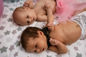 Newborn twin babies, boy and girl