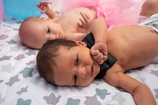 Newborn twin babies, boy and girl