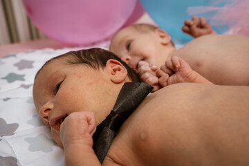 Newborn baby boy lying on bed