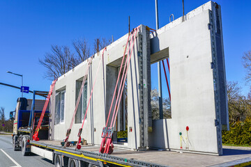 transportation of reinforced concrete precast wall panels for house construction by truck