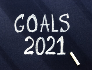 Fototapeta premium Goals 2021 written in white chalk on a dark surface