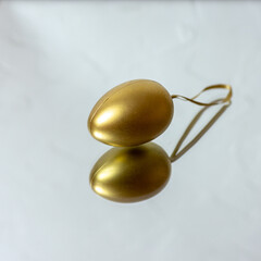 Golden egg on the mirrors. Christmas tree toy. Easter decoration.